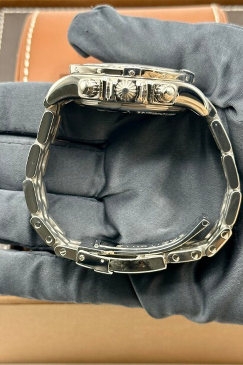 Careful inspection of a luxury watch