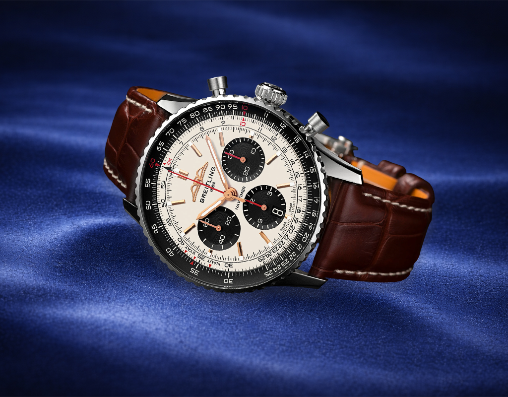 Luxury Breitling watch on blue background