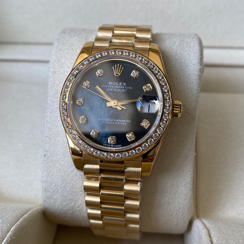 Gold Rolex Datejust watch with diamond dial and diamond bezel on bracelet
