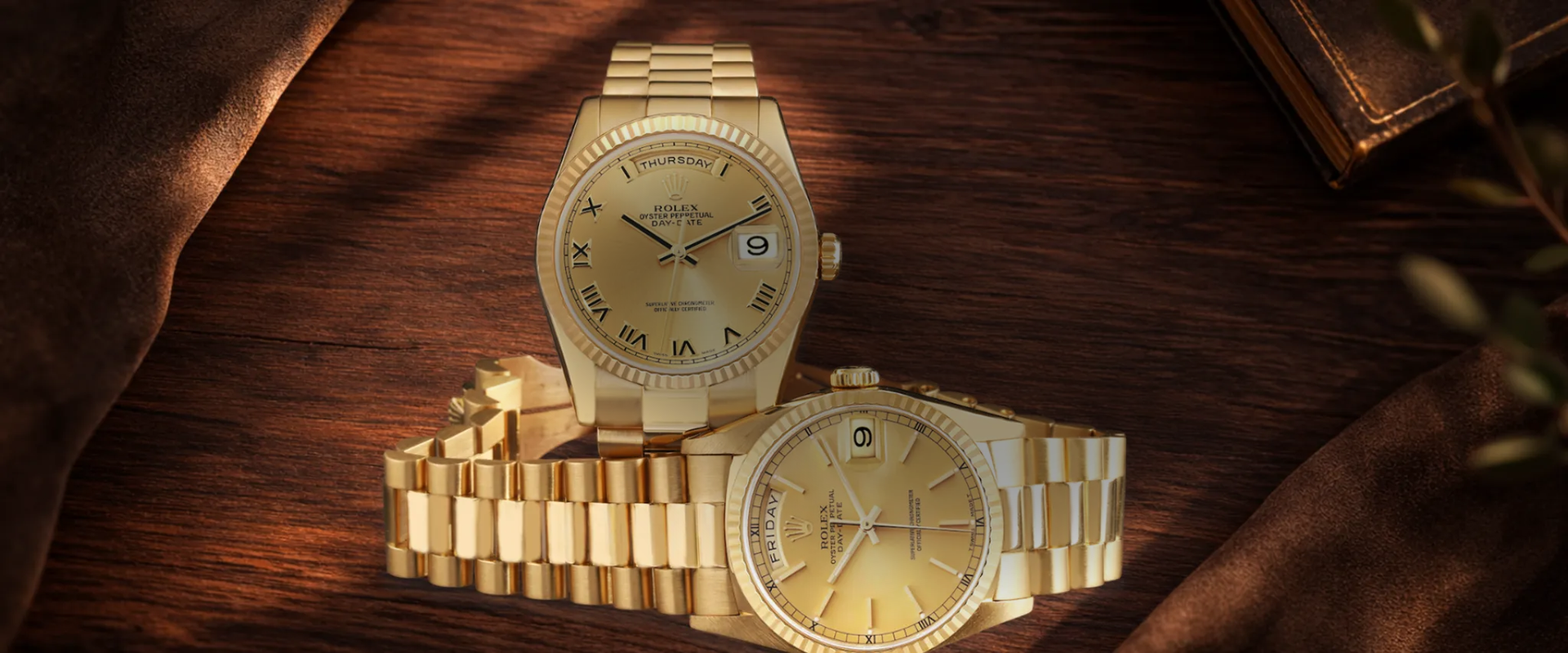 Luxury gold Rolex watches displayed on a wooden tableslider_item_1