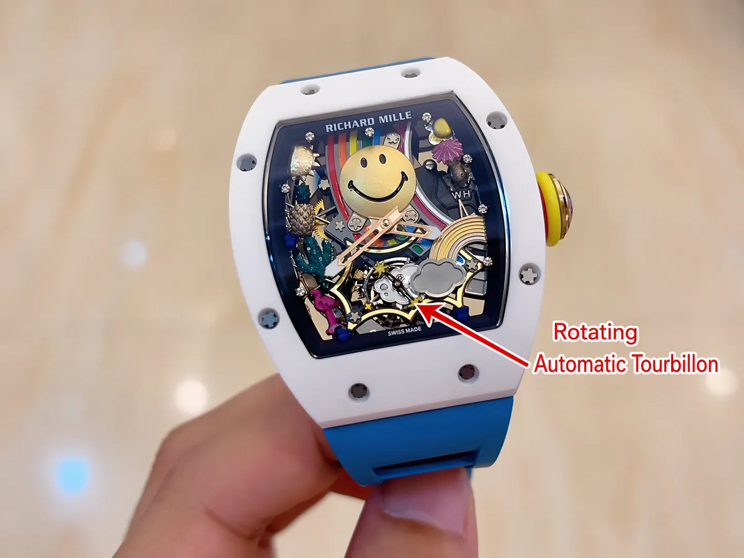 Close-up of RM 88 Smiley automatic tourbillon watch with rotating mechanism highlighted at 6 o’clock, skeleton dial design and white ceramic case