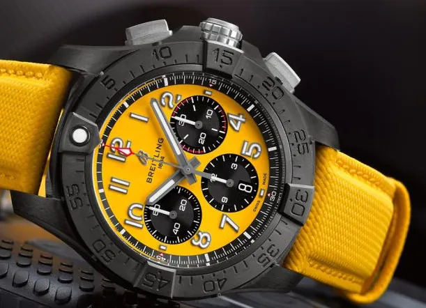 Bold Breitling Avenger chronograph watch, featuring a robust black DLC-coated case, vibrant high-contrast yellow dial with chronograph sub-dials, and matching yellow strap, embodying the collection’s tough aviation-inspired tool watch aesthetic.