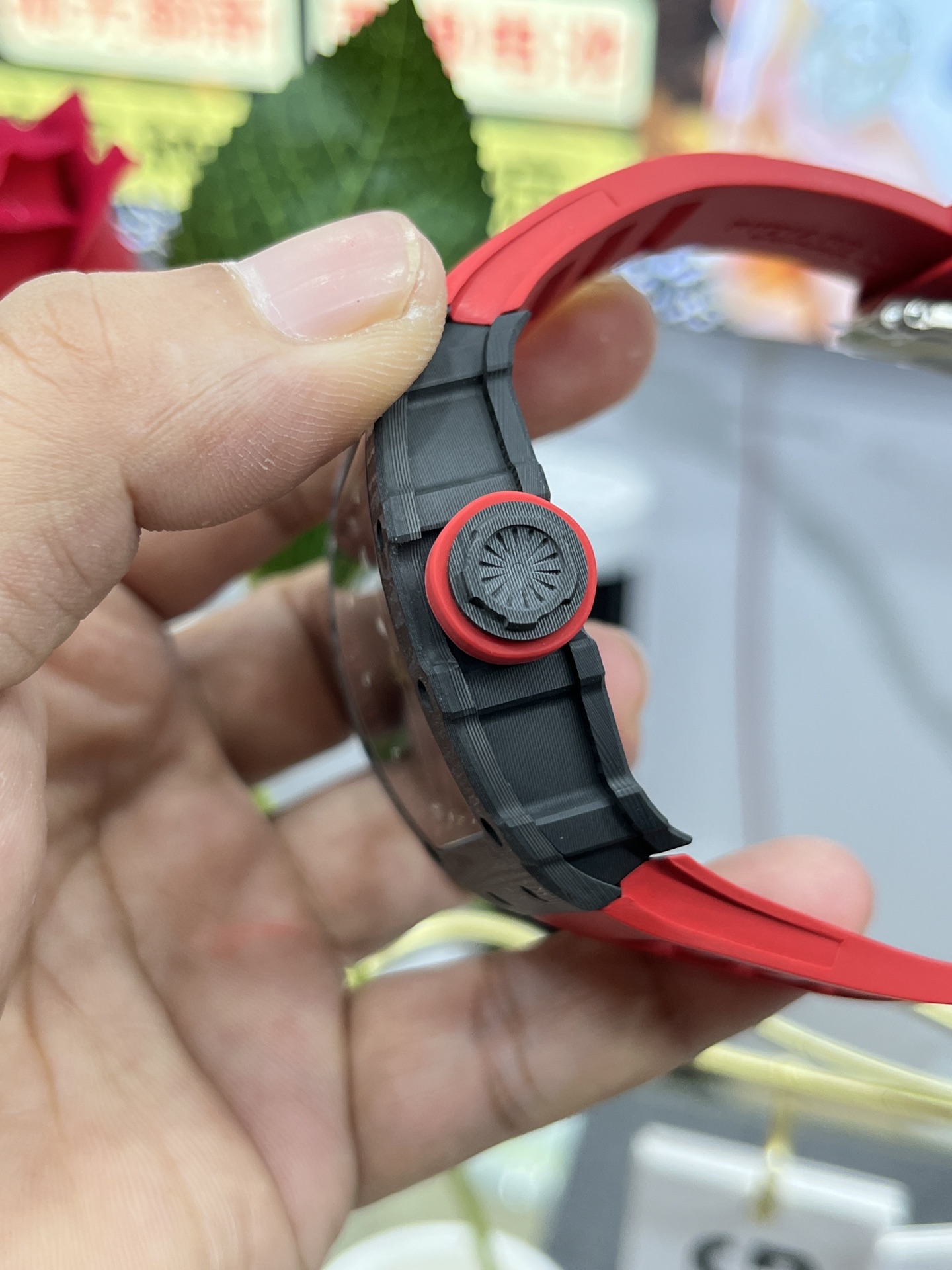 Richard Mille RM35-02 Rafa carbon fiber case red rubber strap red and black crown side detail view