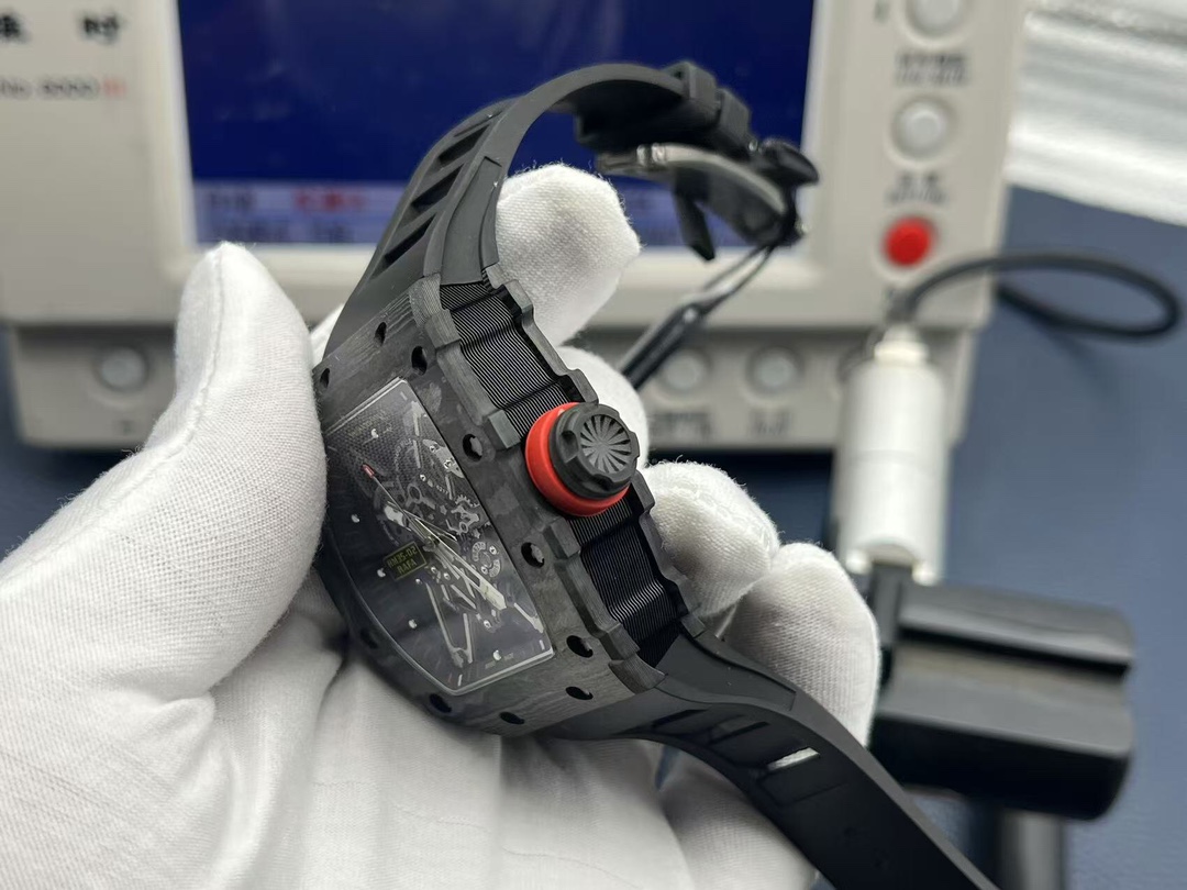 Richard Mille RM35-02 Rafael Nadal black carbon fiber luxury watch with red crown skeleton movement handheld side profile view