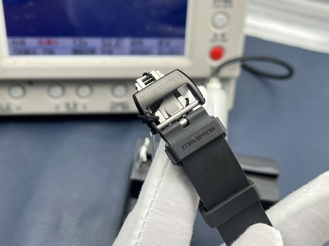 Richard Mille RM35-02 Rafael Nadal black rubber strap deployment clasp engraved logo handheld strap detail view