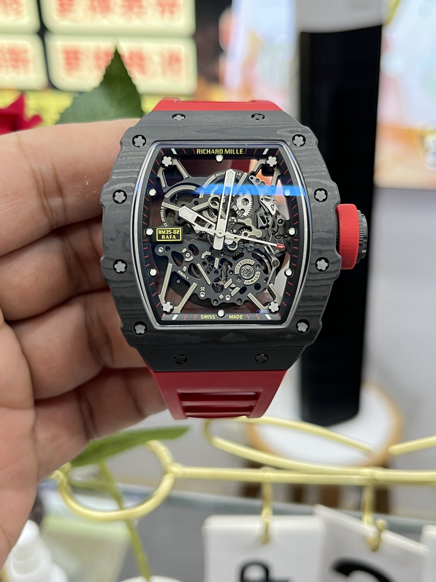 Richard Mille RM35-02 Rafa Skeleton Watch Carbon Fiber Case Red Rubber Strap Front View In Hand Close-Up