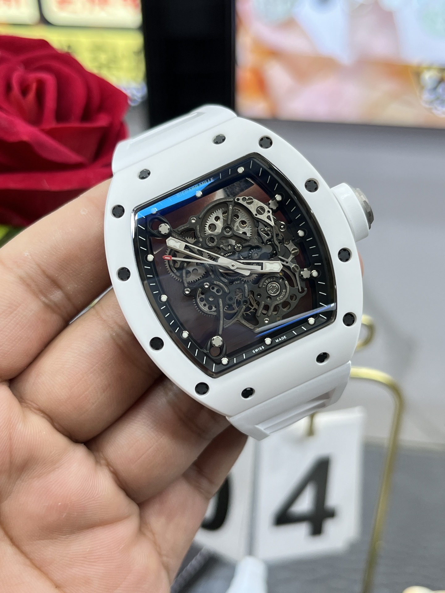 Richard Mille RM055 BBR white ceramic case black skeleton dial white strap skeleton movement handheld multi-angle detail view