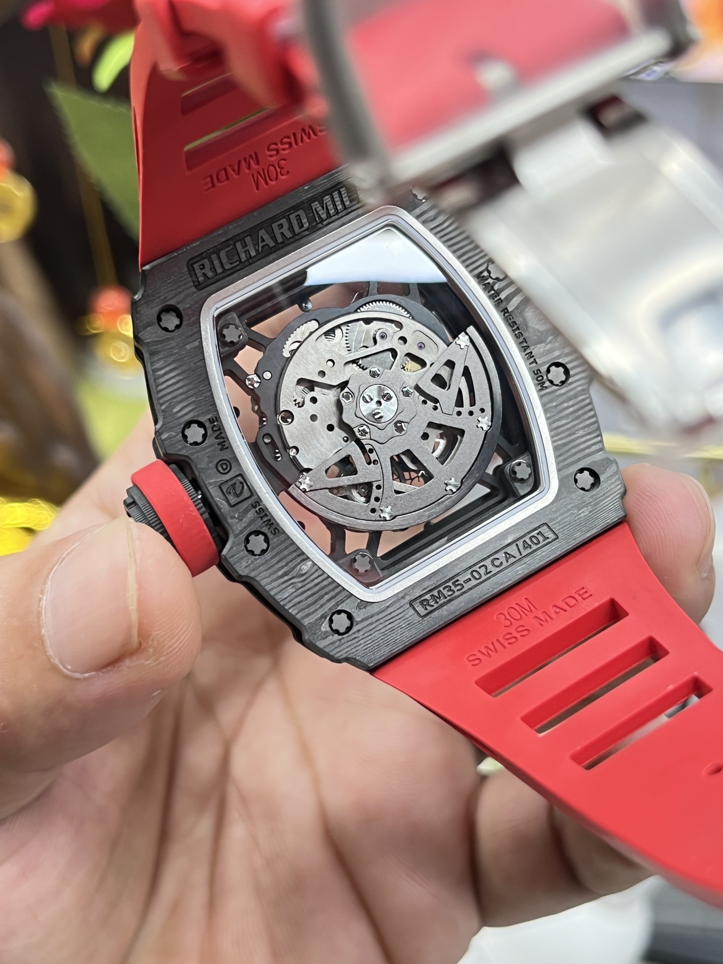 Richard Mille RM35-02 Rafa Skeleton Watch Carbon Fiber Case Red Rubber Strap Caseback Movement Close-Up In Hand