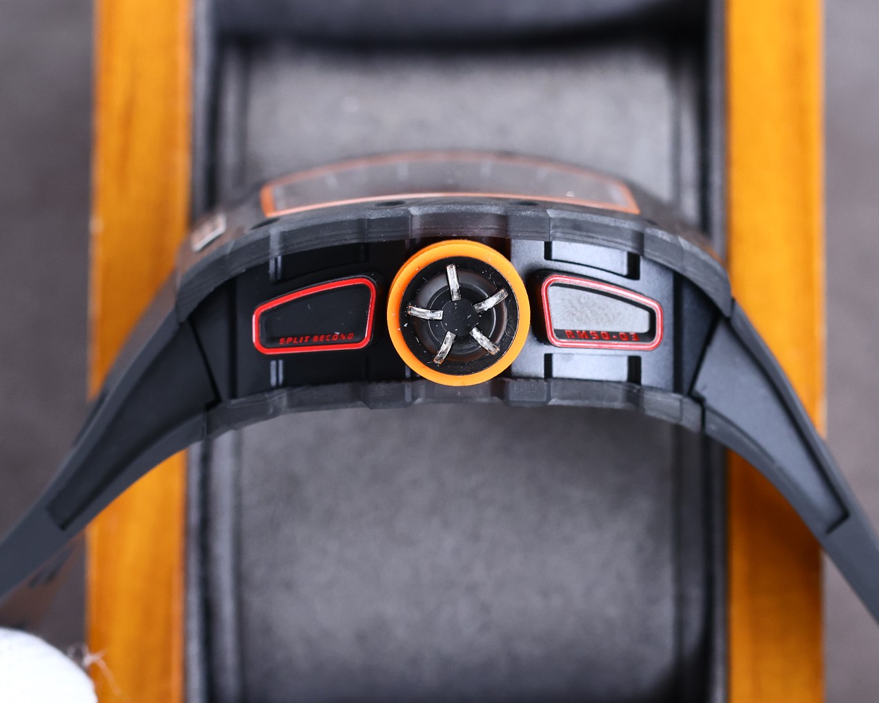 Richard Mille RM50-03 McLaren F1 Tourbillon Carbon Case Black Orange Accents Black Rubber Strap Crown and Side Controls Detail View