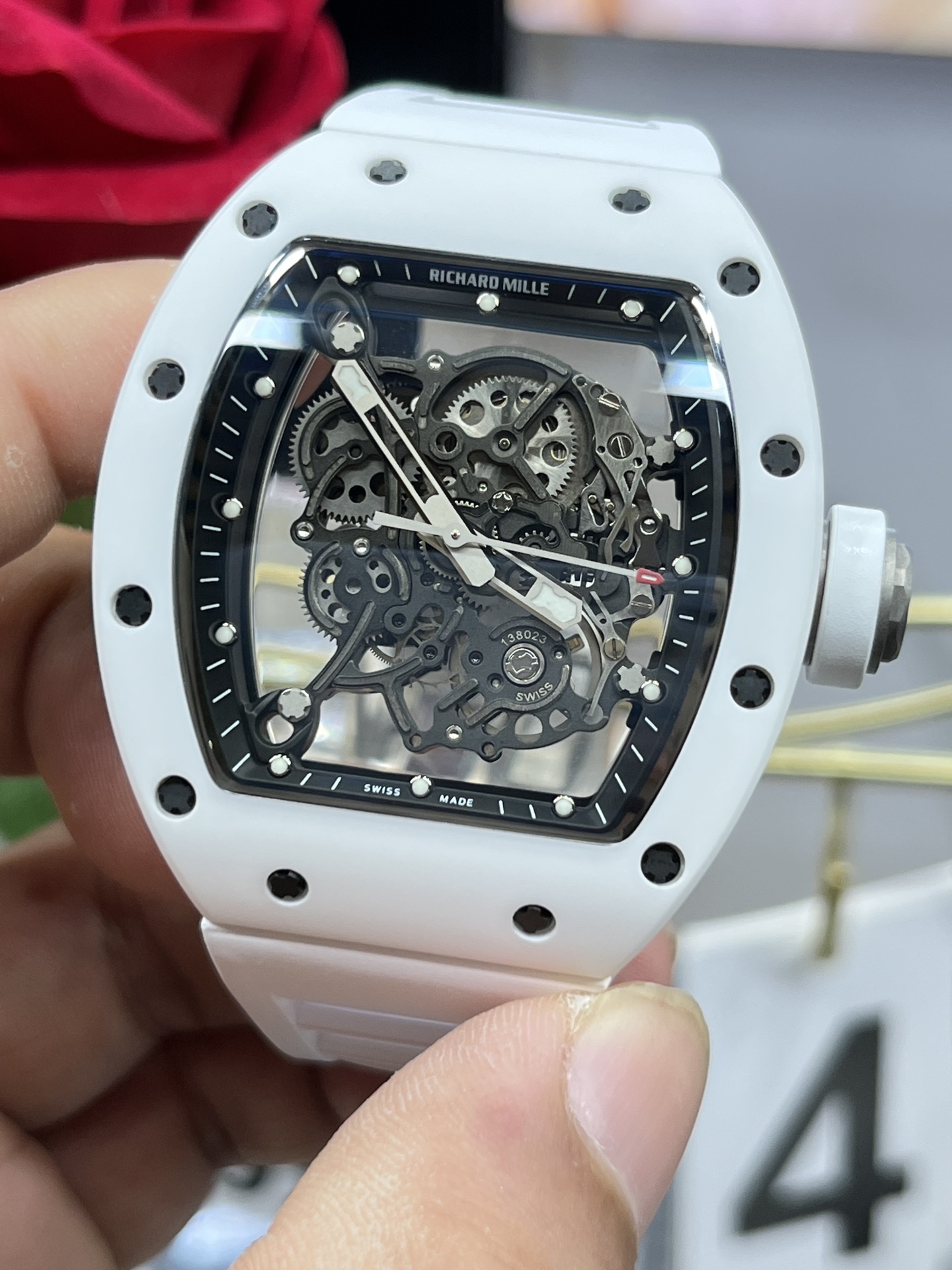 Richard Mille RM055 BBR white ceramic case black skeleton dial white strap skeleton movement handheld detail view