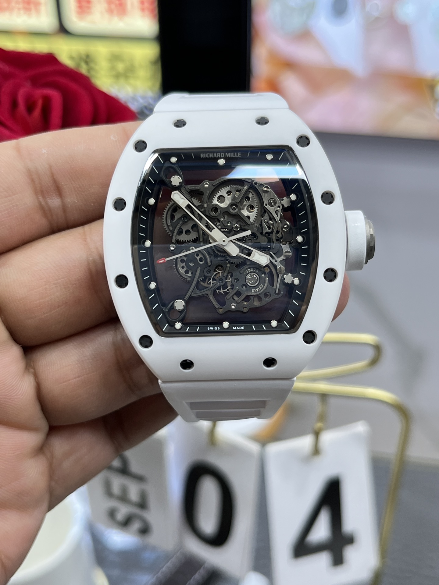 Richard Mille RM055 BBR white ceramic case black skeleton dial white strap skeleton movement handheld front view