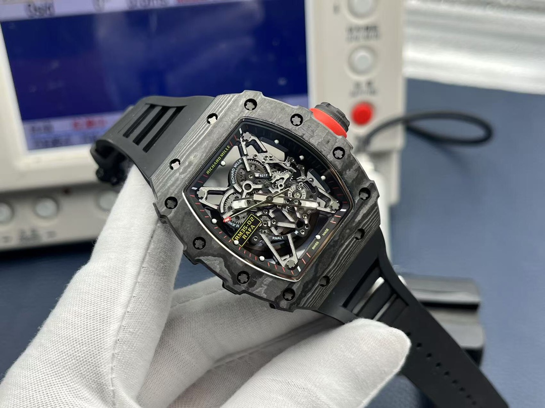 Richard Mille RM35-02 Rafael Nadal luxury watch black carbon fiber case red crown openworked dial handheld close-up detail view