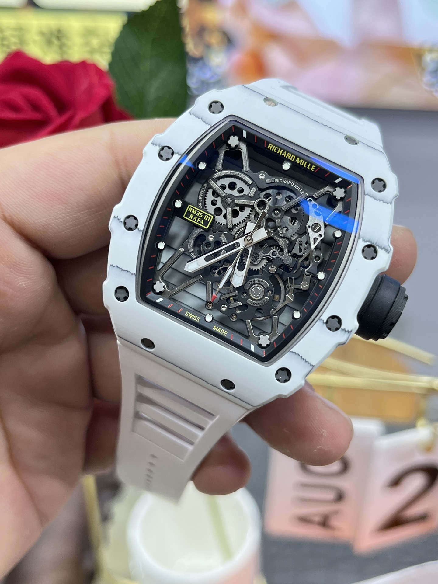 Richard Mille RM35-01 White Carbon Case Black Skeleton Dial White Rubber Strap Handheld Angled Side View