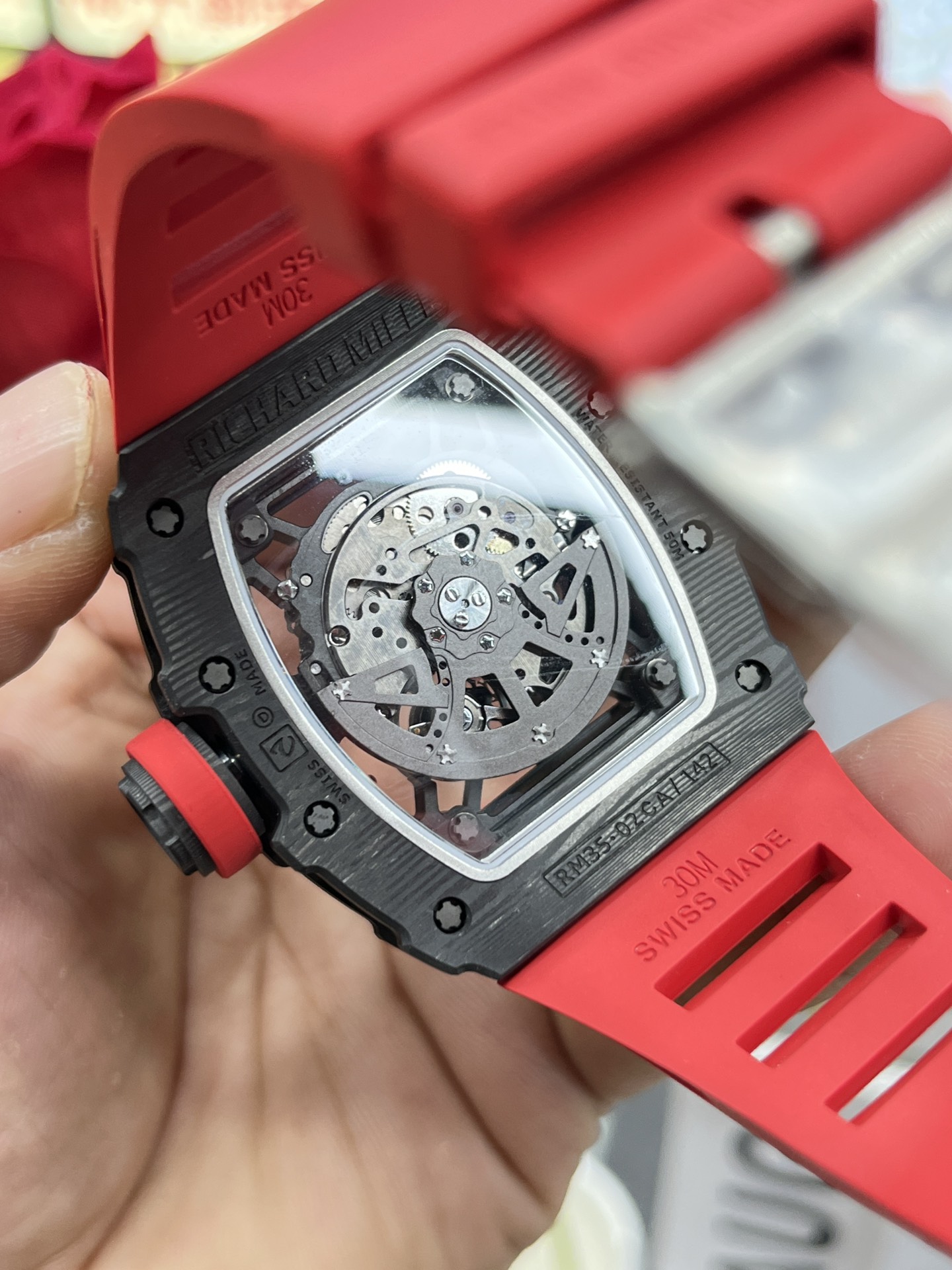 Richard Mille RM35-02 Rafa carbon fiber case red rubber strap exhibition caseback movement detail view