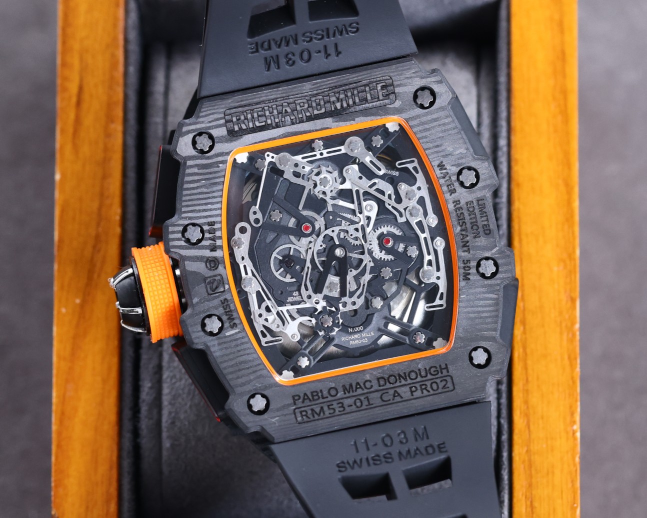 Richard Mille RM50-03 McLaren F1 Tourbillon Carbon Case Black Orange Accents Black Rubber Strap Caseback Movement Detail View