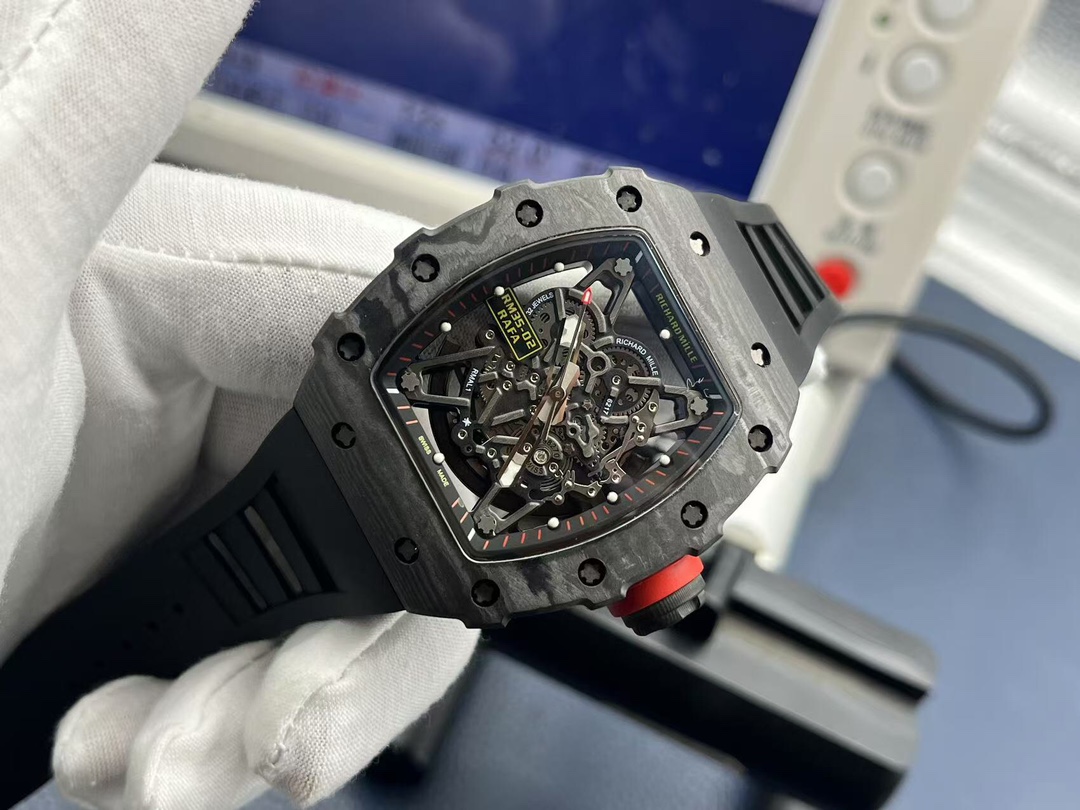 Richard Mille RM35-02 Rafael Nadal black carbon fiber watch with red crown skeleton movement dial handheld angle side detail view