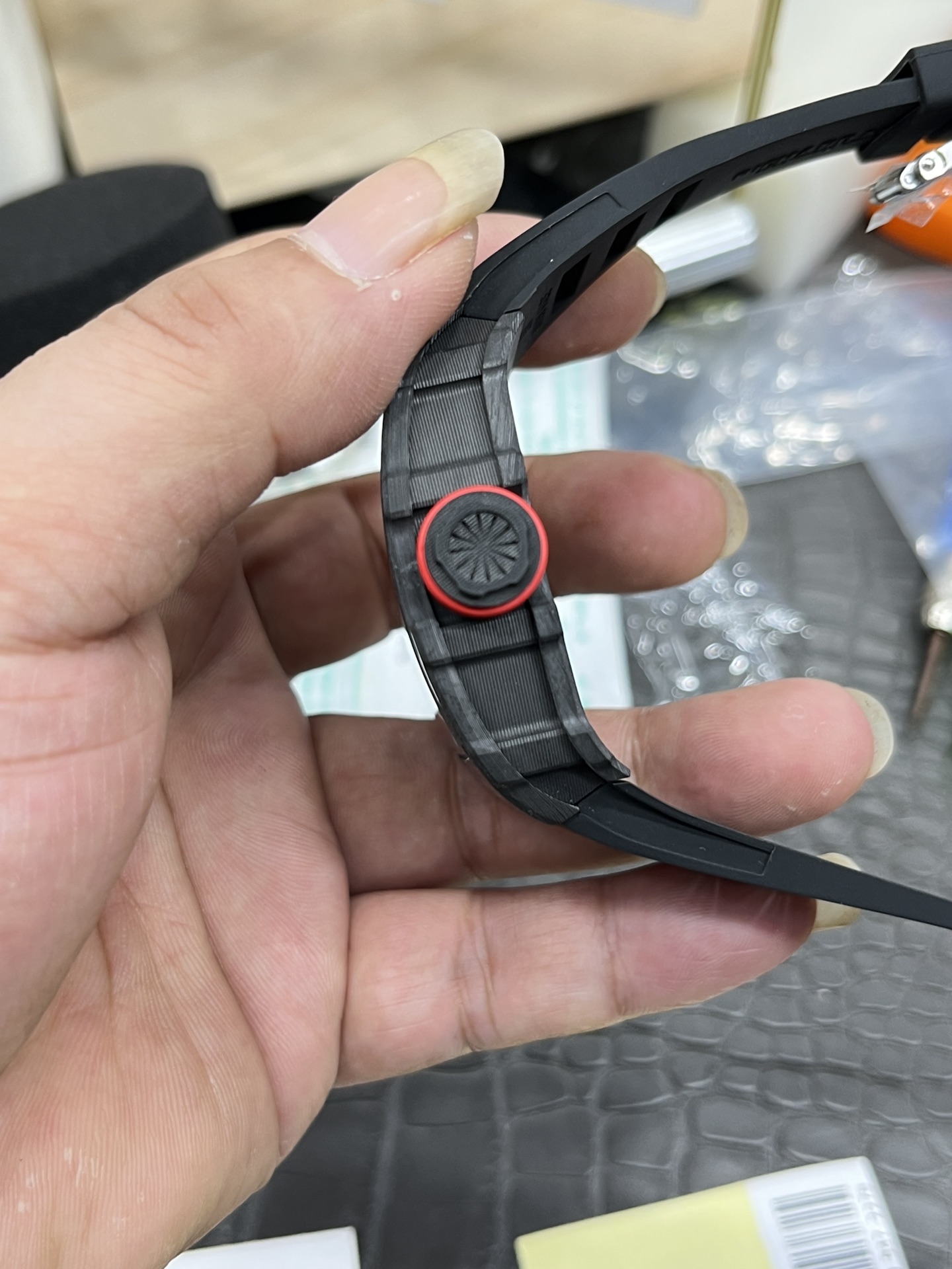 Richard Mille RM35-01 Rafa carbon fiber case red crown black strap crown side detail view