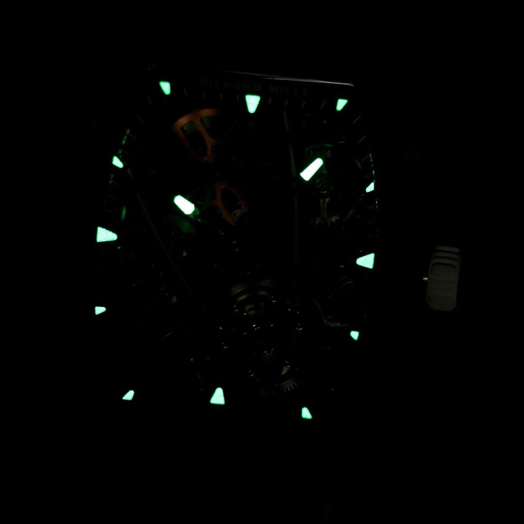 Richard Mille RM27-05 black carbon fiber case white strap flying tourbillon watch lume detail view