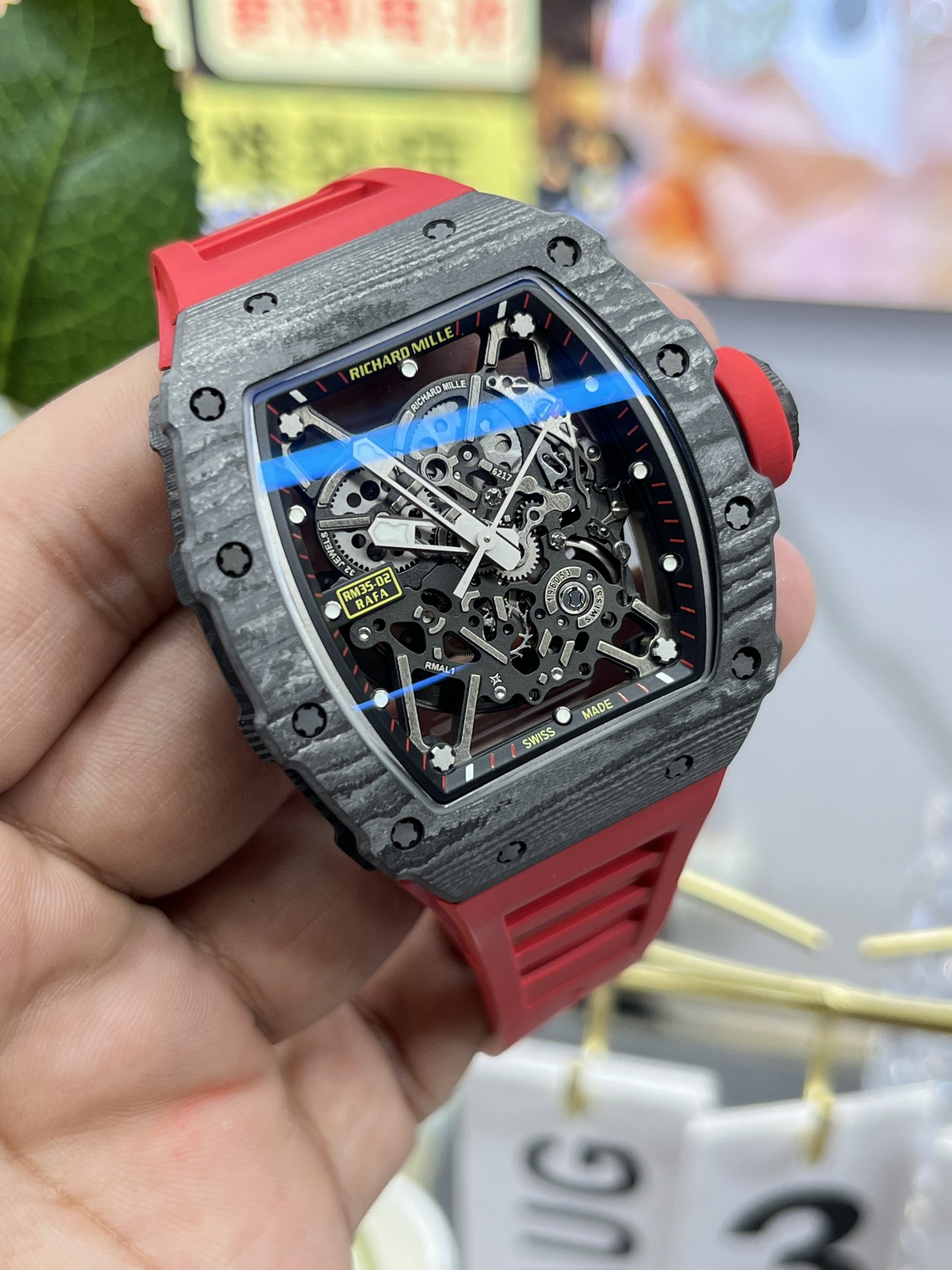 Richard Mille RM35-02 Rafa carbon fiber case black skeleton dial red rubber strap angled front detail view handheld display