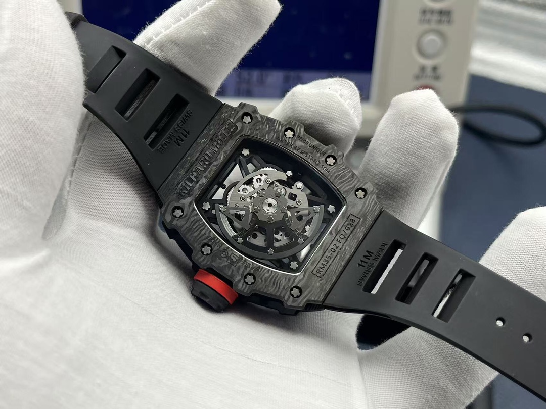 Richard Mille RM35-02 Rafael Nadal black carbon fiber watch exhibition caseback automatic movement rubber strap handheld rear detail view