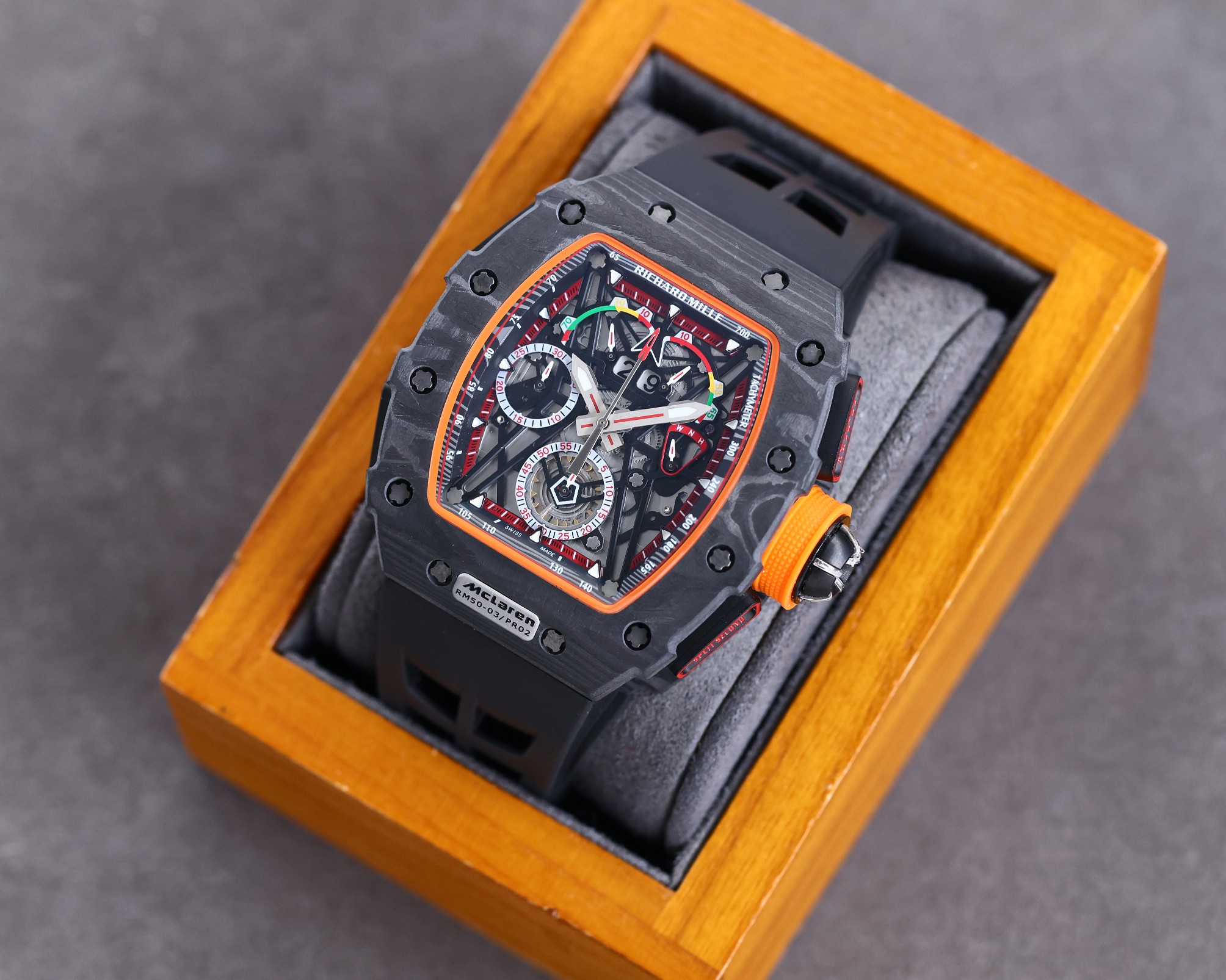 Richard Mille RM50-03 McLaren F1 Tourbillon Carbon Case Black Orange Accents Black Rubber Strap Case Angle Detail View
