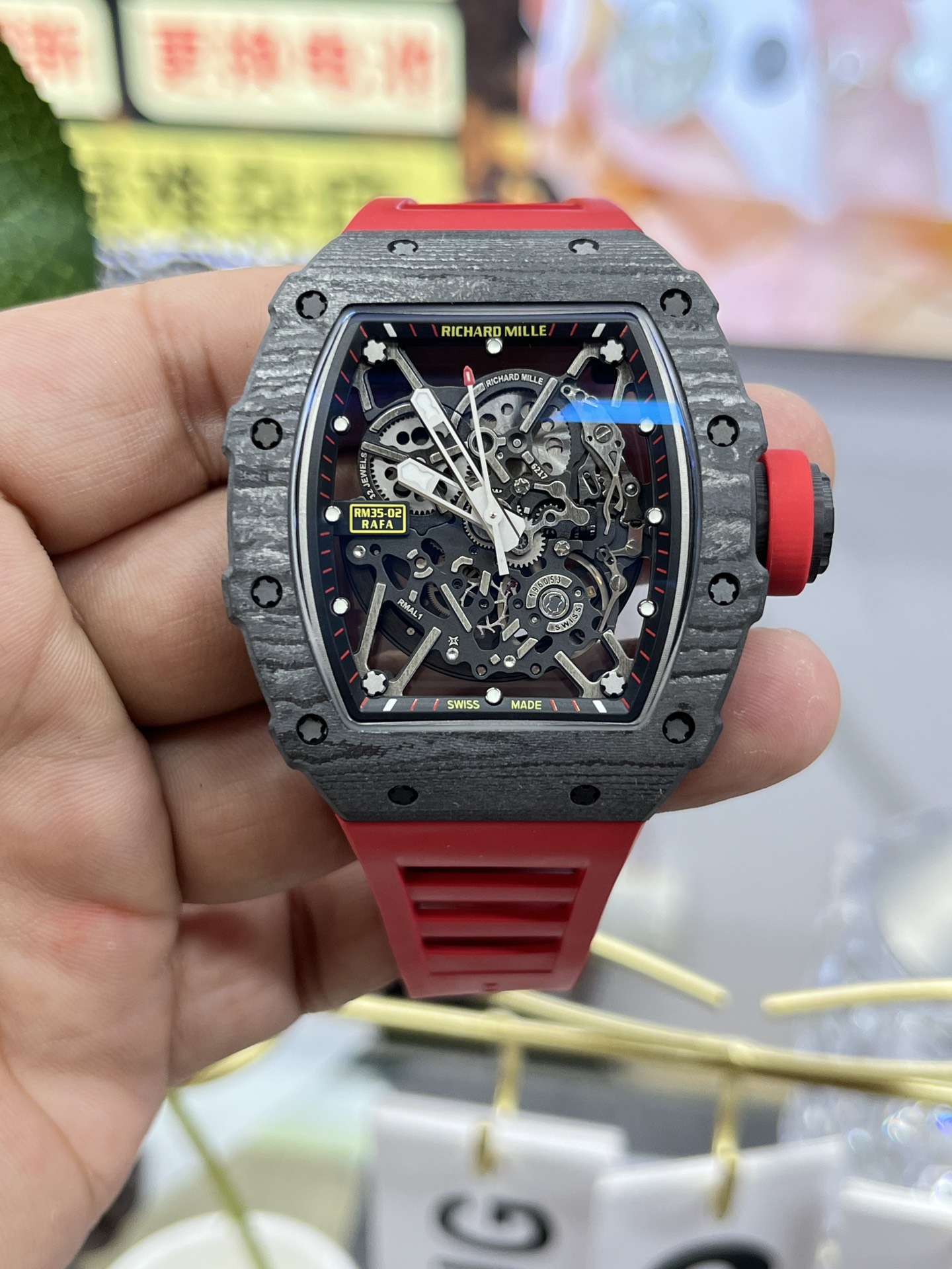 Richard Mille RM35-02 Rafa carbon fiber case black skeleton dial red rubber strap front view handheld display
