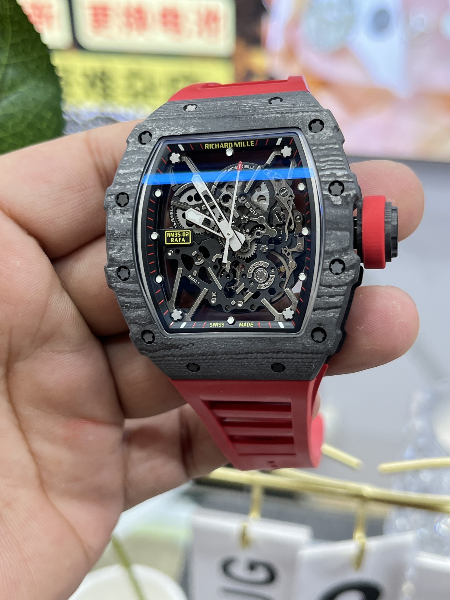 Richard Mille RM35-02 Rafa carbon fiber case black skeleton dial red rubber strap front view handheld detail display