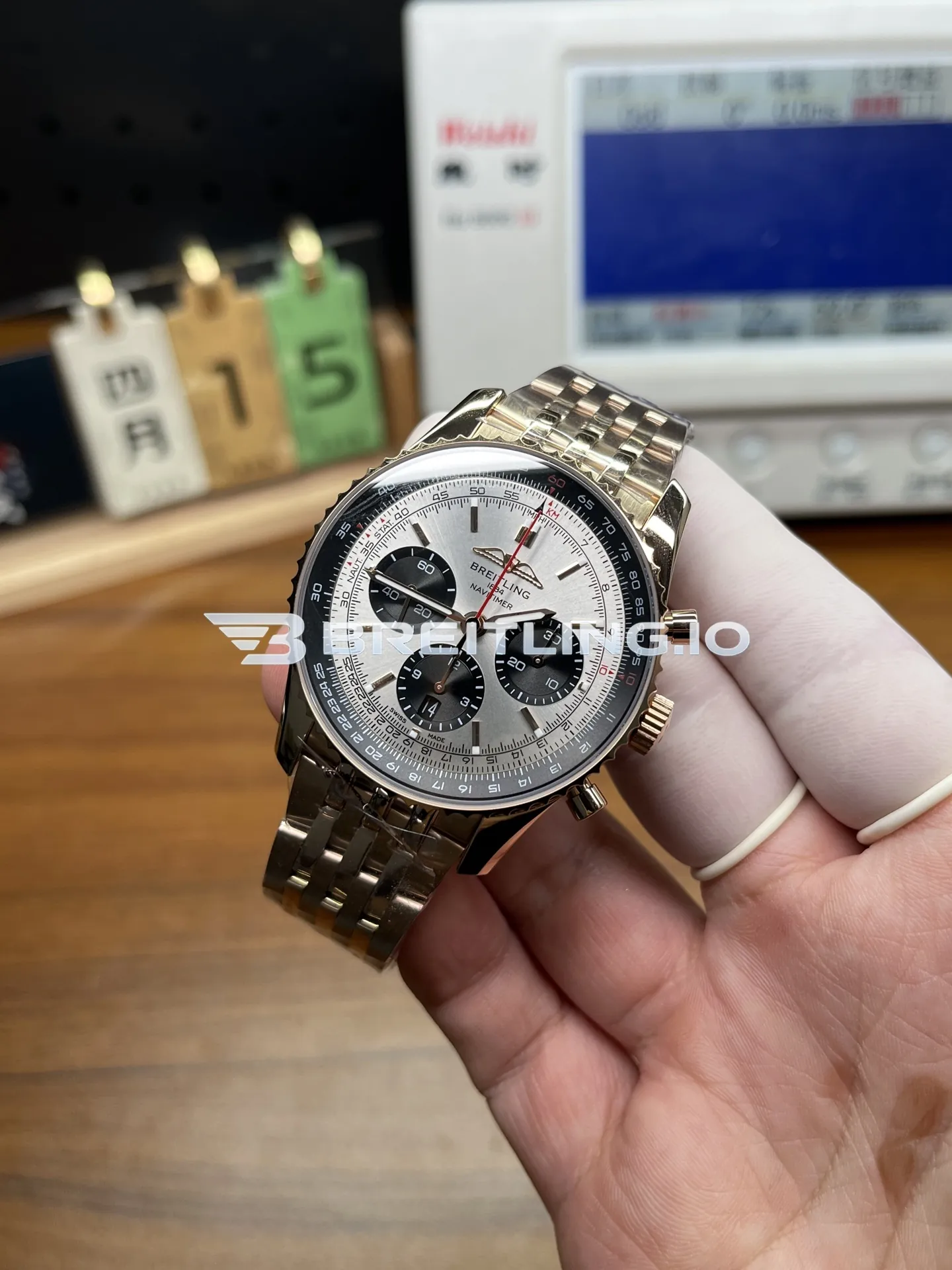 Breitling Navitimer RB0137241G1R1 46mm Silver Sunburst Chronograph Dial Solid 18K Rose Gold Case Flight Slide Rule Bezel Replica Side View